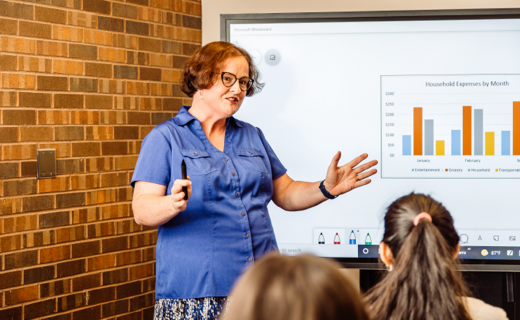 Woman in front of a chart